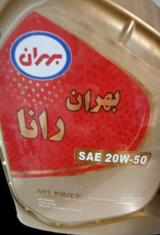 تصویر محصول روغن موتور بهران رانا، شامل گالن طلاییرنگ ۴ لیتری با برچسب قرمز که اطلاعات فنی، بارکد و نشانهای استاندارد روی آن درج شده است